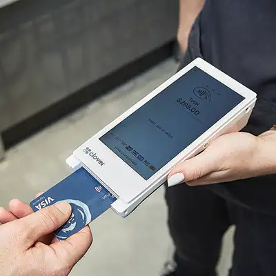 Person inserting card into mobile chip reader Person inserting card into mobile chip reader